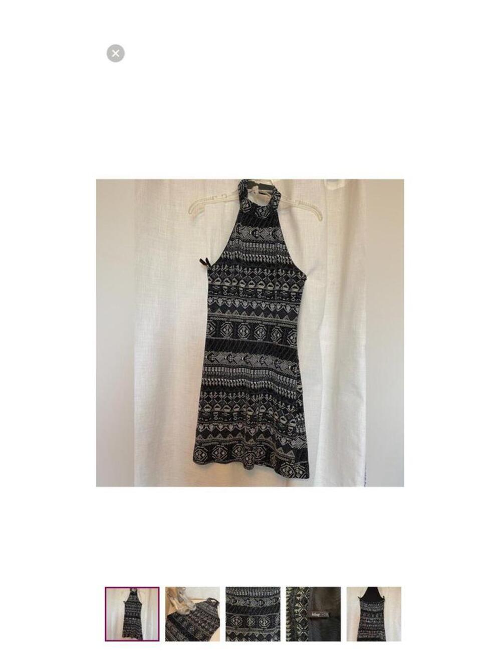 Black and white halter dress with accents of silver. Made by bebop.